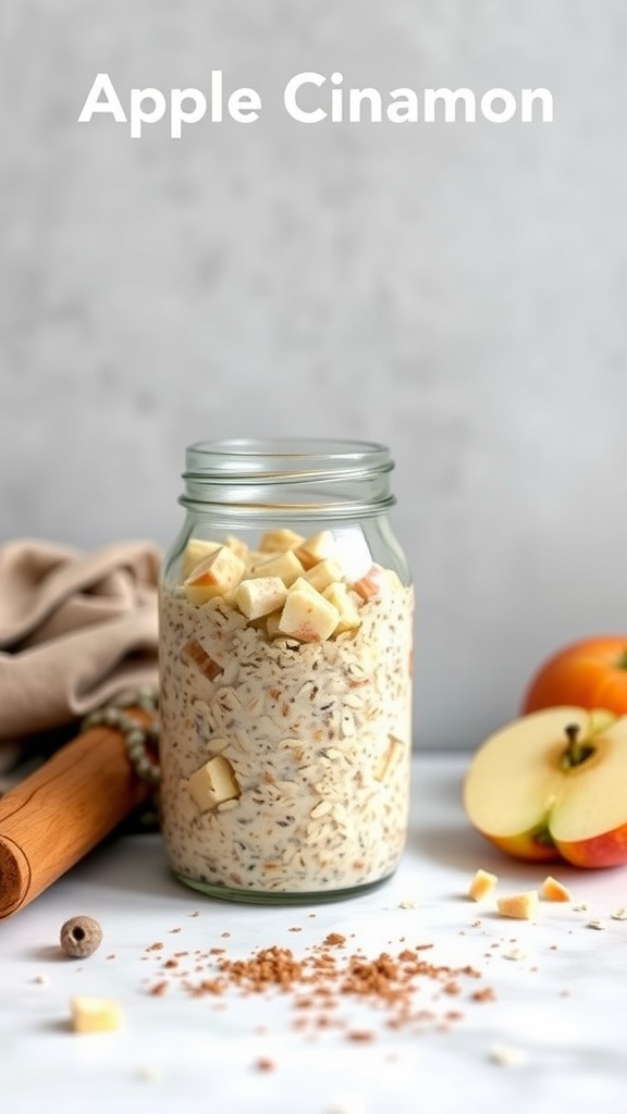 A jar of apple cinnamon overnight oats with diced apples and a sprinkle of cinnamon.